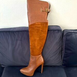 1pair of black thigh high stiletto boots and 1pair of brown brand new.